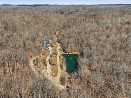 Secluded 25-Acre Retreat with Two Custom Cabins, Spring-Fed Pond & Waterfall