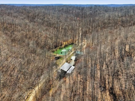 Secluded 25-Acre Retreat with Two Custom Cabins, Spring-Fed Pond & Waterfall