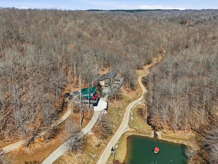Secluded 25-Acre Retreat with Two Custom Cabins, Spring-Fed Pond & Waterfall