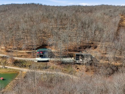 Secluded 25-Acre Retreat with Two Custom Cabins, Spring-Fed Pond & Waterfall