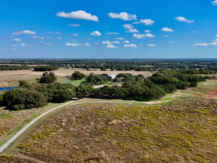 100 Acres | Land with Home for Sale McLoud OK — Five Ponds, Two Water Wells, Multiple Shops, Adjoining Acreage 