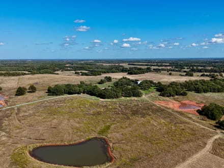 100 Acres | Land with Home for Sale McLoud OK — Five Ponds, Two Water Wells, Multiple Shops, Adjoining Acreage 