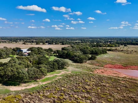 100 Acres | Land with Home for Sale McLoud OK — Five Ponds, Two Water Wells, Multiple Shops, Adjoining Acreage 