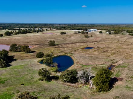 100 Acres | Land with Home for Sale McLoud OK — Five Ponds, Two Water Wells, Multiple Shops, Adjoining Acreage 