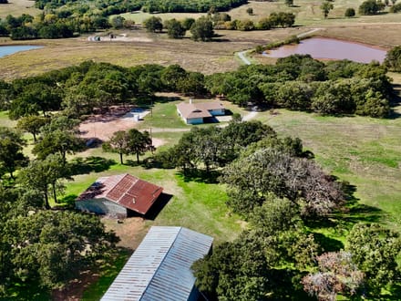 100 Acres | Land with Home for Sale McLoud OK — Five Ponds, Two Water Wells, Multiple Shops, Adjoining Acreage 