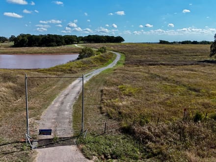 100 Acres | Land with Home for Sale McLoud OK — Five Ponds, Two Water Wells, Multiple Shops, Adjoining Acreage 
