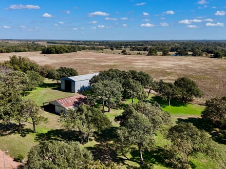 100 Acres | Land with Home for Sale McLoud OK — Five Ponds, Two Water Wells, Multiple Shops, Adjoining Acreage 