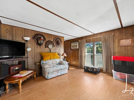 Private Country Living on 5± Acres with Creek & Mature Pines