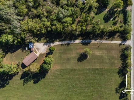 Private Country Living on 5± Acres with Creek & Mature Pines