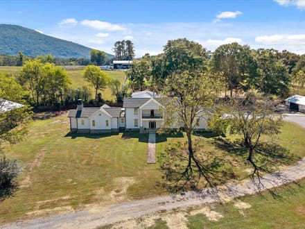 Step into a remarkable blend of historic charm and modern luxury at 986 Ketner Mill Lane.