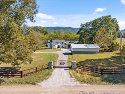 Step into a remarkable blend of historic charm and modern luxury at 986 Ketner Mill Lane.