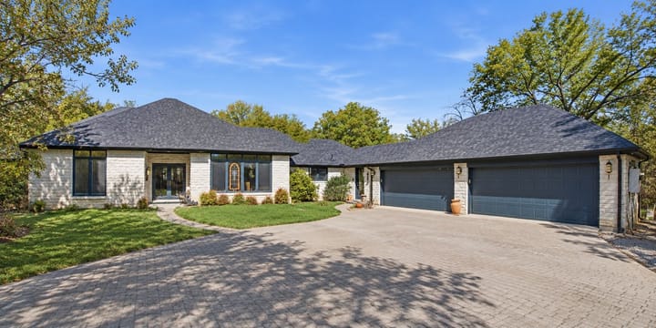 Limestone Home With Two Garage Doors