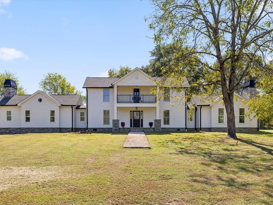 Step into a remarkable blend of historic charm and modern luxury at 986 Ketner Mill Lane.